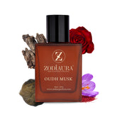 A square-shaped bottle of Zodiaura Oudh Musk perfume EDP spray for men, with a dark cap and a red label. The bottle is displayed with saffron threads, a piece of wood, and a red rose in the background, suggesting the fragrance's woody and musky accords.